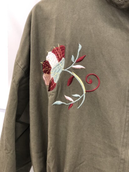 A floral detail on a jacket at The Silver Dahlia. Florals and olive green colors are a popular fall fashion trend. 