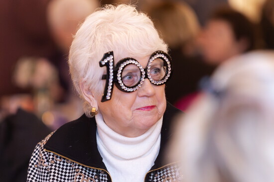 Helga Hilson enjoys the event with "100" glasses 