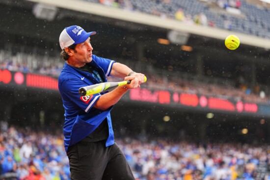 Paul Rudd winds up for a hit during the celebrity softball game. Photo by: Kyle Rivas