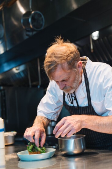 Chef Matthew Bousquet plating a meal