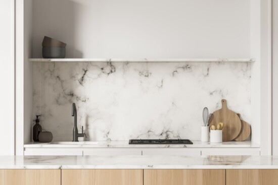 Gorgeous stone backsplashes and added shelving are on-trend for kitchens.