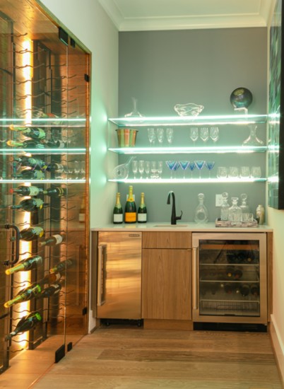 Wine room adjacent to kitchen for entertaining and storing wine and glassware.