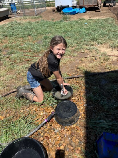 Scarlett Johnson doing chores on the farm.