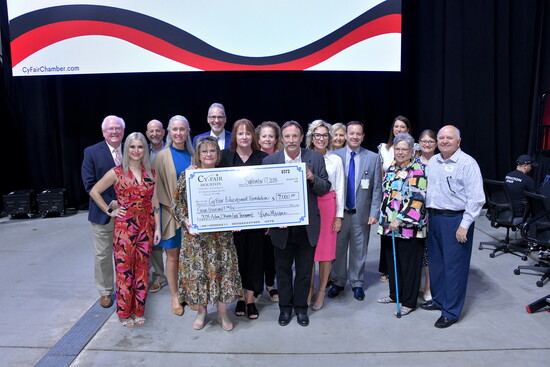 Check presentation with Cy-Fair Educational Foundation from funds generated by our annual Adam J. Skinner Golf Tournament
