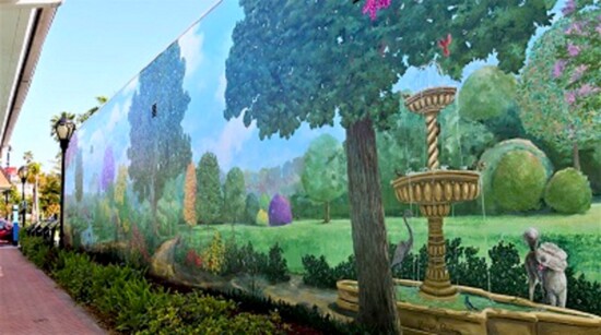 The mural “Healing in the Enchanted Garden,” painted by Joseph Barron, is located on Founder’s Way at the Green Parrot Restaurant.