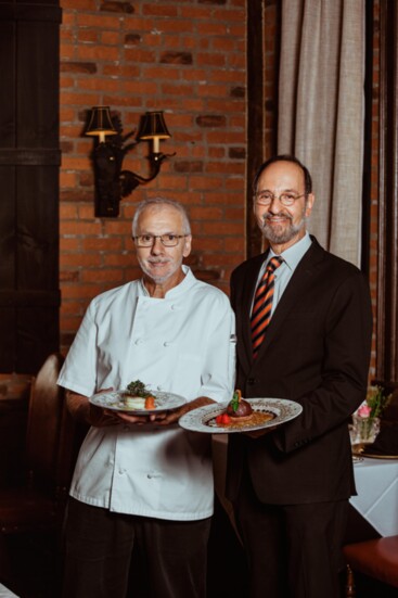 Executive Chef Richard Blondin holding the Shrimp Gateau; Owner Kamal Boulos holding the Chocolate Grand Marnier Bombe