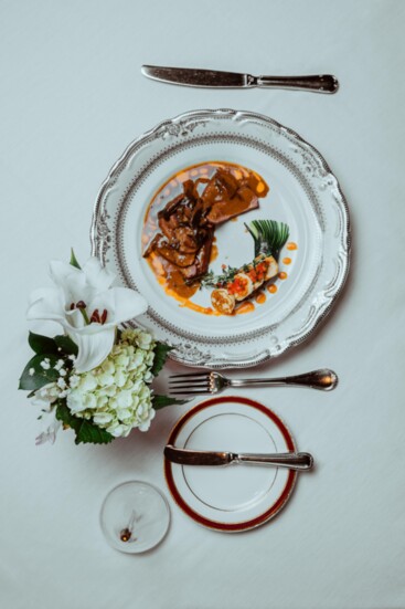 Roasted Ostrich Fan Filet: mushroom duxelle, with potato blinis, zucchini fan, wild mushroom bordelaise, a touch of beurre monte sauce (sauced by Liam Nehring)