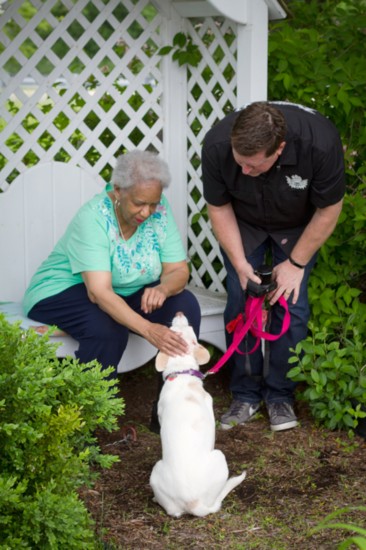 The blessing of the pets at the event, here for Emma (with owner Michael Beightol).