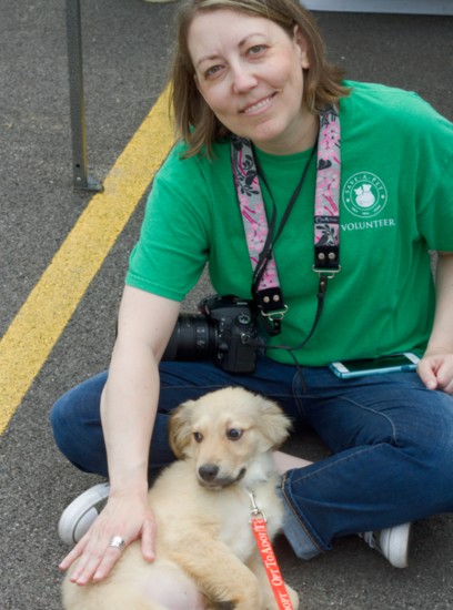 Photographer and Volunteer Andi McCulloch, with furry friend.