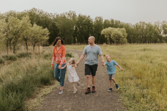 Jenner, her husband Kevin, and their kids Ellis and Iva, hiking at Signature Bluffs Natural Area