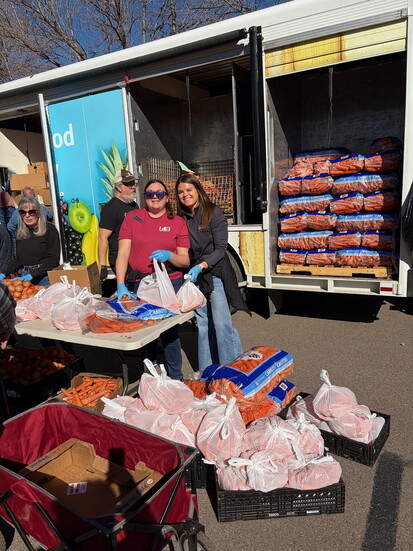 Kristina Akin and Sarah Poynter volunteering at the Weld Food Bank’s Mobile Food Pantry.