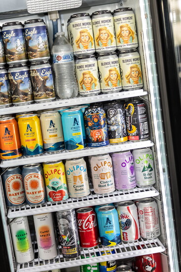 A fridge stocked with cans of drinks. Photo Credit: Kerry Paradis Photography