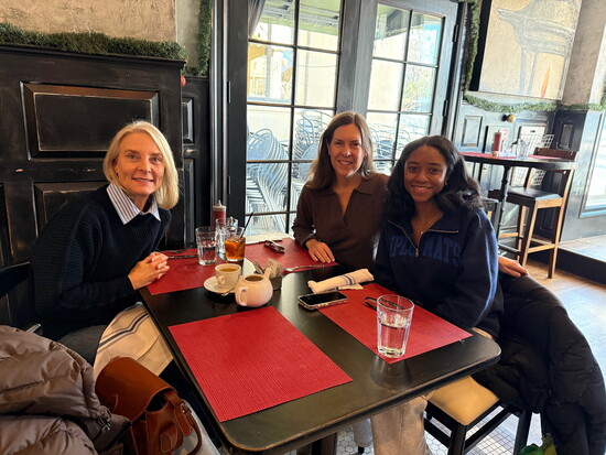 2024 RABC graduate Myah Jones reunites with her academic advisor Kristen Esemplare (left) and host mom Tyler Kate Burton