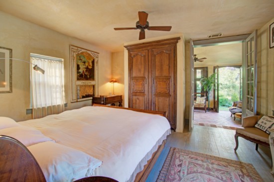 The master bedroom offers direct access to the terraced gardens.