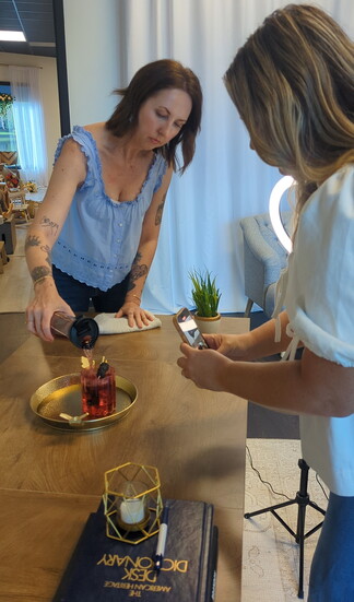 A Creator Day participant styles and captures product content during a guided brand session at Shannon Matlock’s Lakeside studio.