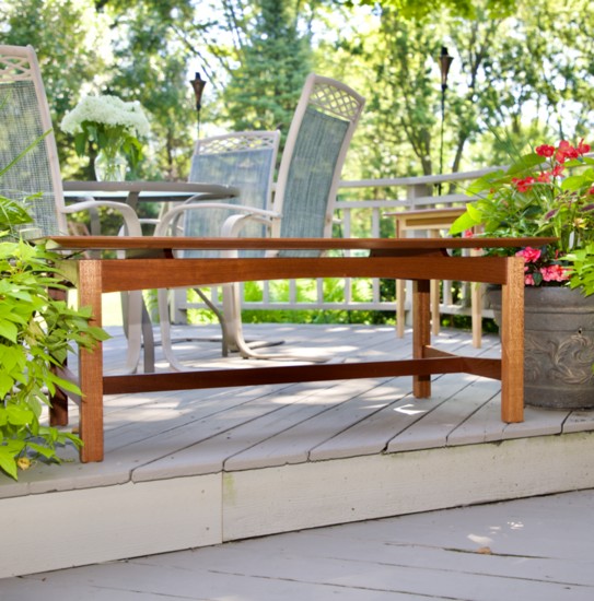 A floating-top, Williams-handcrafted coffee table temporarily enjoys some sunshine on the deck for this photo. 