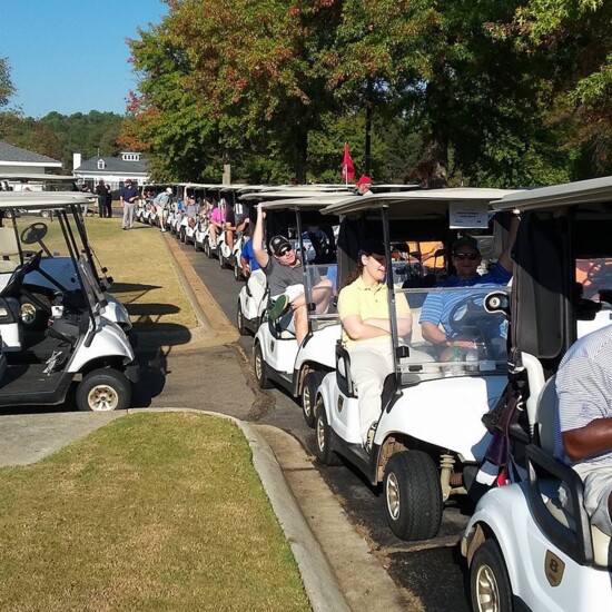 Folks lined up for the Open Wide Open golf tourny