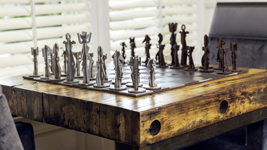 Front room’s custom metal chess set: By California metal artist Gregory Hawthorne