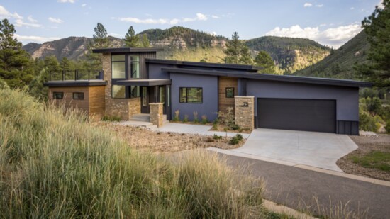 The home's exterior settles naturally into the surrounding environment.
