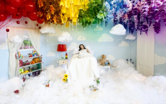 Annie wakes in her room, now transformed into a rainbow above the clouds.