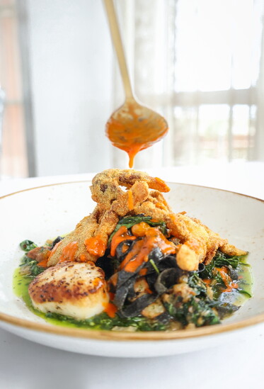 Seafood Pasta: Scallops, fried softshell crab, cuttlefish ink tagliatelle pasta, cherry tomatoes, baby kale pesto, roasted pepper oil