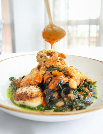 Seafood Pasta: Scallops, fried softshell crab, cuttlefish ink tagliatelle pasta, cherry tomatoes, b 
