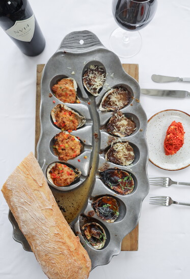 The Frenchie, Gorgeously Garlic, & Bienville: locally sourced broiled oysters.