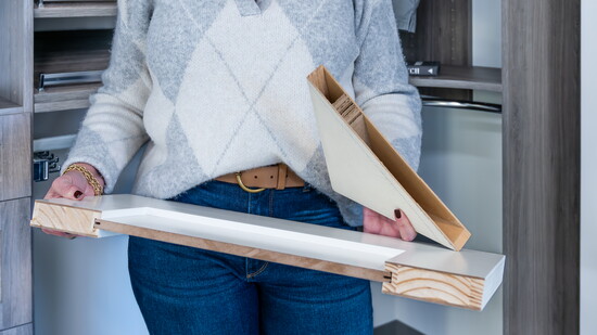 Janet shows off the difference between their doors and a typical door