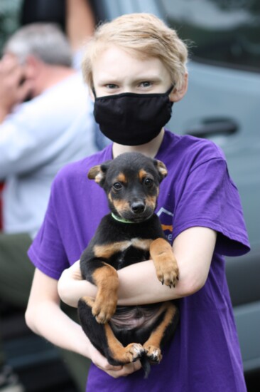 Haughton holds Nathan, a Shepherd / Collie Mix Age: 8 weeks Gender: Male of "The Neshoba 6"