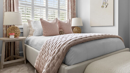 Andria works with craftsmen throughout the south and had this custom upholstered bed made to optimize the natural light.