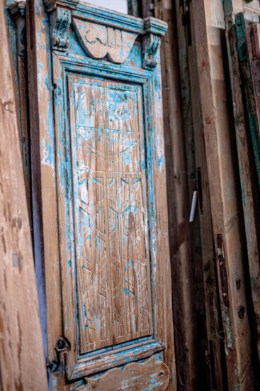 Faded paint and antique patina add to the charm of the doors