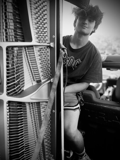 Danny's son Tae working on a piano.