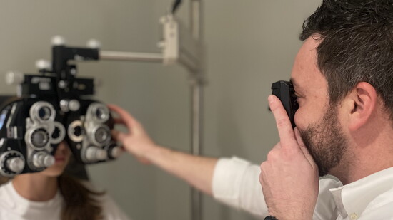 Dr. Spencer Boozer with a patient