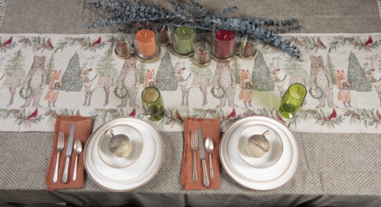 This whimsical "Christmas Cheer" table runner with a winter woodland design adds charm to your holiday table setting. 