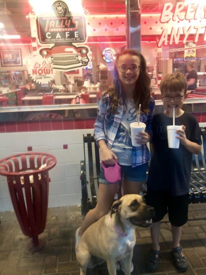 Murphy, 13, and Graham, 1,, along with Tilly, enjoy the '50s vibe at Tally's Good Food Cafe in Tulsa.