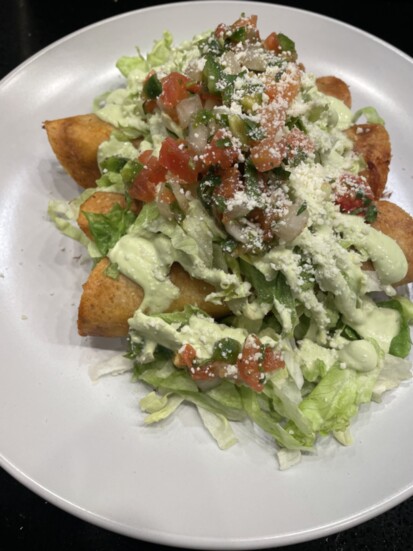 One of El Luchador’s most popular appetizers: the crispy chicken taquitos 