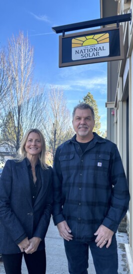 National Solar Founder, President and co-owner Janelle Lancaster and VP of Production and co-owner John Harley in front of their office in Northwest Crossing.