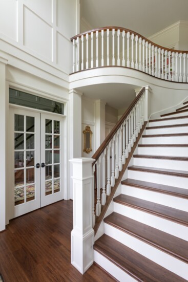 Renovated foyer with curved landing