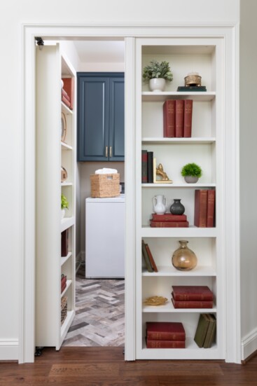 Existing laundry behind a hidden bookcase