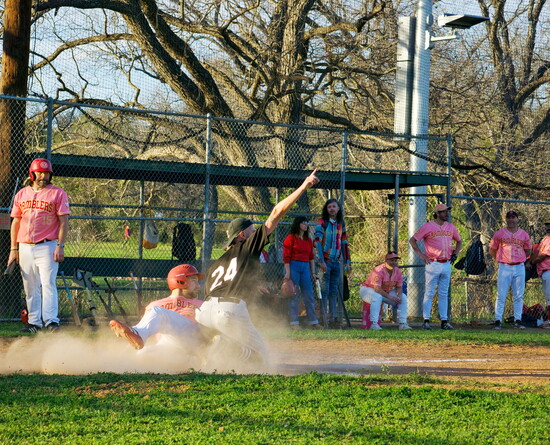 A member of the Cap City Cobras tags out a member of the East Austin Ramblers at Govalle Park.