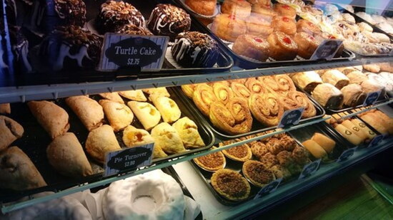 Montgomery Bakehouse – Fresh-baked pastries, cookies, and cakes displayed in the family-run bakery case.