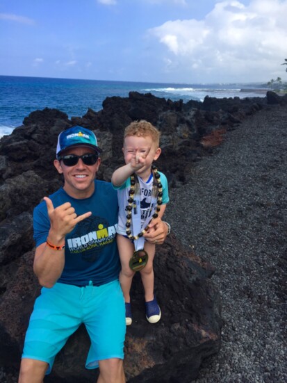Dr. Conroy and his son Nate on lava rocks at the Hawaii IRONMAN