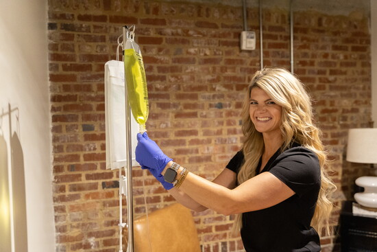 Jacy Hawkins, RN, prepares an IV treatment. 