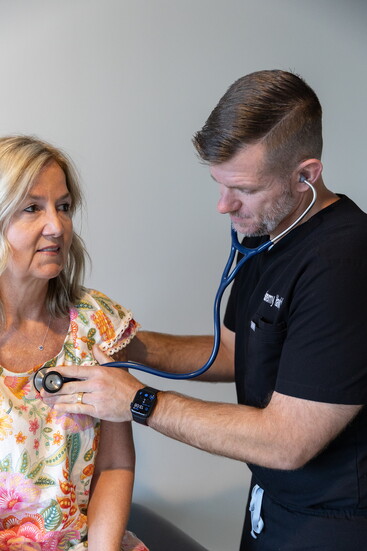 Dr. Jeremy Hawkins treats a patient. 