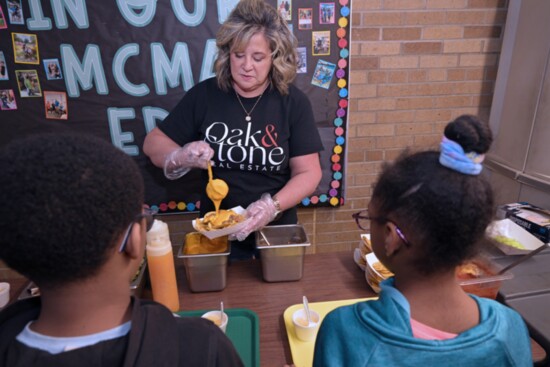 Kathleen serves lunch to students at Mount Clemens Montessori  Academy