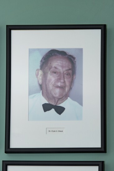 Photo of Dr. Clyde Erbeck at the Mason Historical Society which also displays a set of his dental tools. 