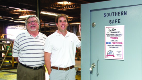 Mike and David Tidwell proudly display one of their safe rooms.