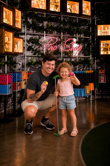 Families can putt, laugh, and explore quirky challenges throughout Holey Moley's themed courses.