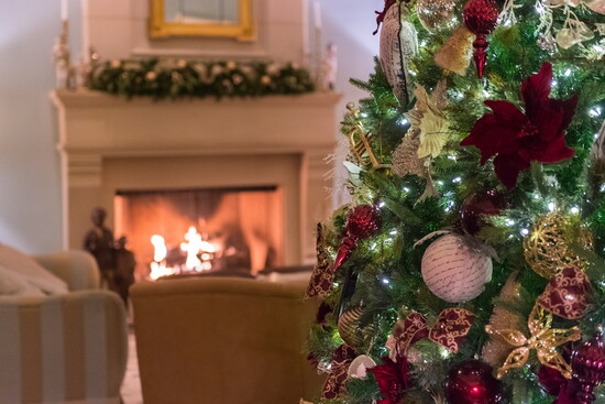 The coziest of Christmas corners. This is the perfect spot to curl up by the fireplace and soak in the holiday splendor.