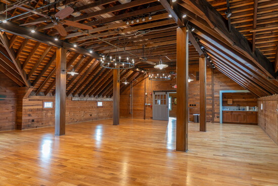 The Barn’s Hayloft features original wood beams, doors & hay lifts, alongside modern skylights, a wet bar & a state-of-the-art AV system.